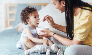 A mother feeding a child.