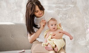 Brushing baby's hair.