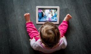 toddler on tablet