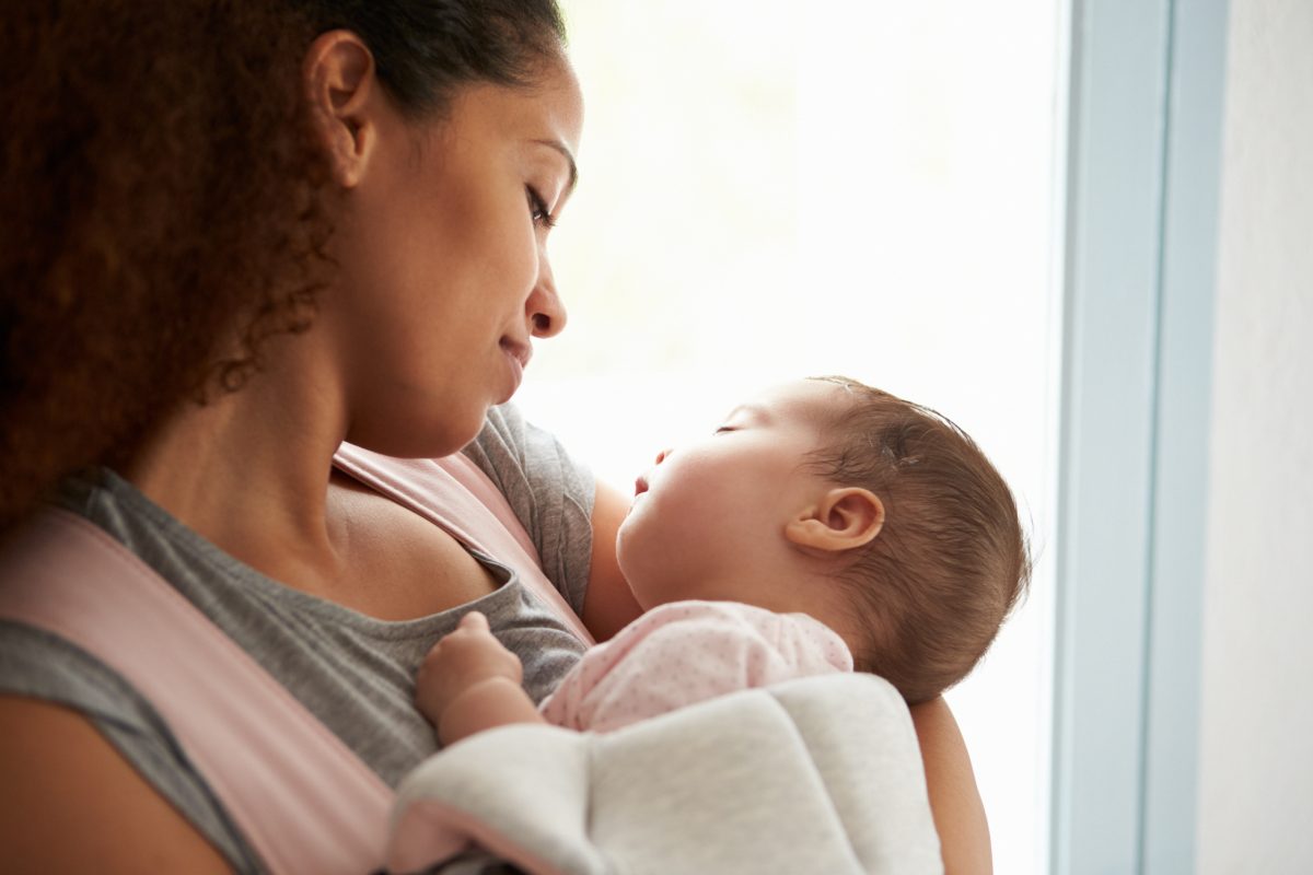 overtired infant help mother holding sleeping baby jpg