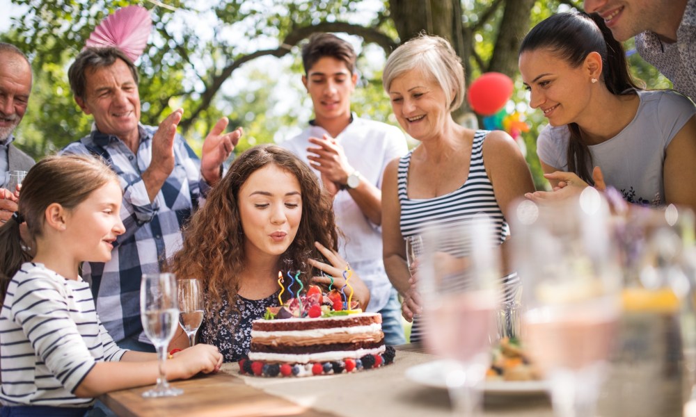 Teenage girl and her family celebrating her birthday