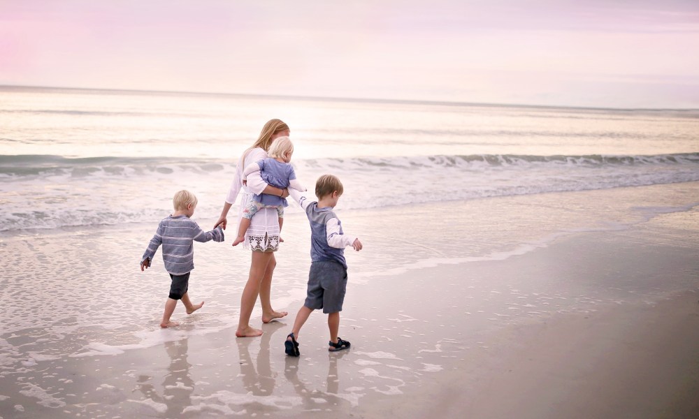 Family walks on a beach