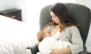 A mom and baby breastfeeding