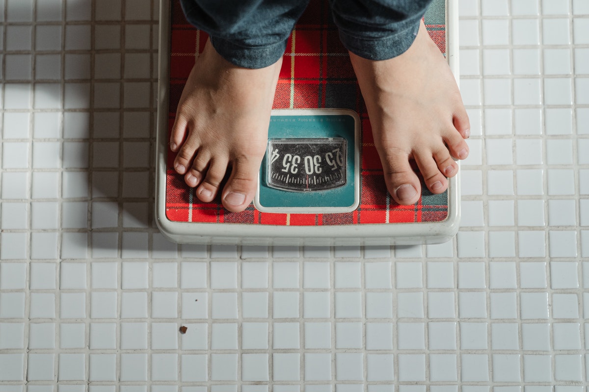 Standing on a weight scale