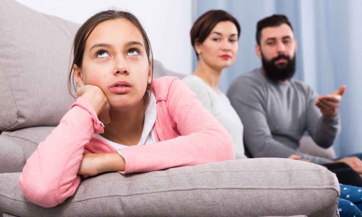 Teenager rolling eyes at parents