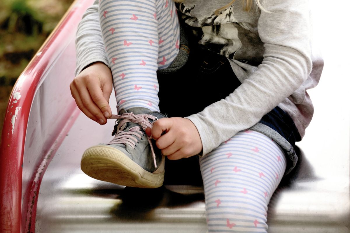 Child Tying Their Shoe