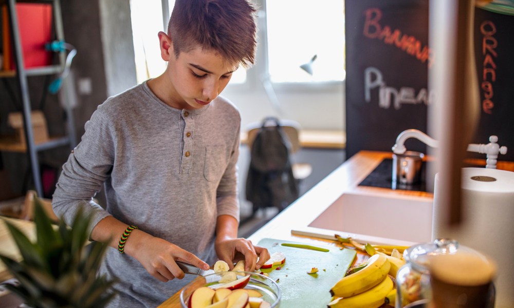 A child making themselves a snack