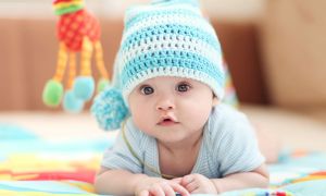 Baby boy wearing a blue knitted cap