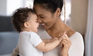 Woman holding a baby.