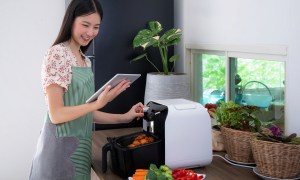 Mom making dinner using an air fryer