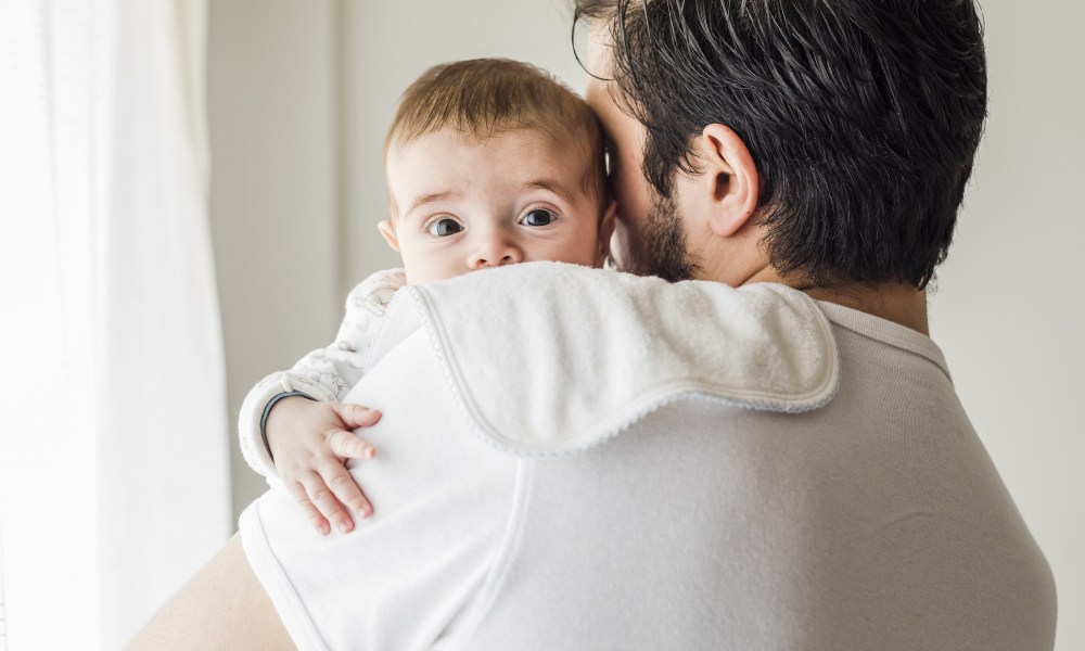 Father burping his baby