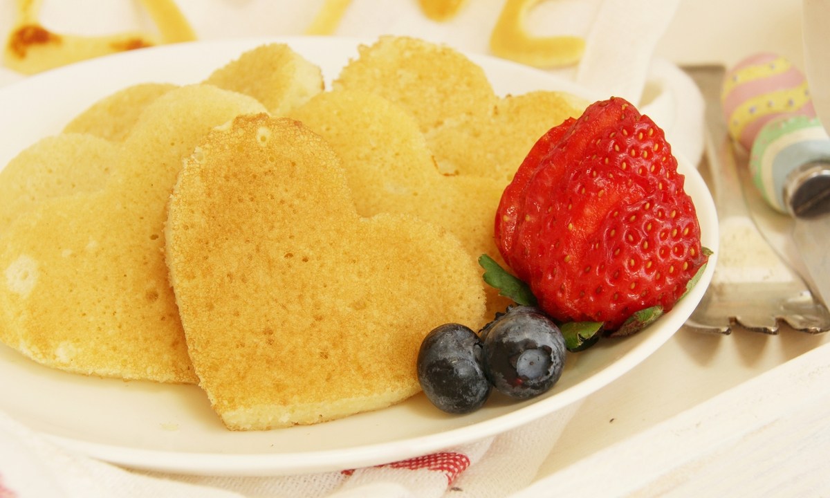 Plate of heart-shaped pancakes for Valentine's Day.