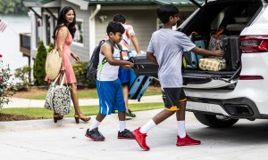 Family packing the car for a road trip