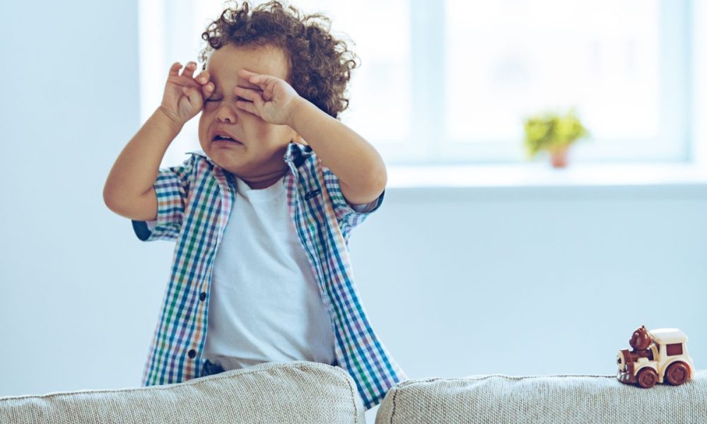 A toddler crying in their room.