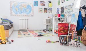 A child's room that's a bit messy with toys and items all over