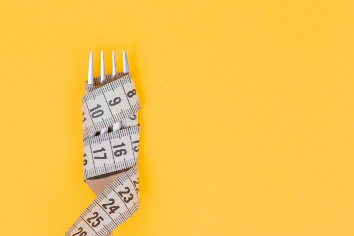 Measuring tape around a fork