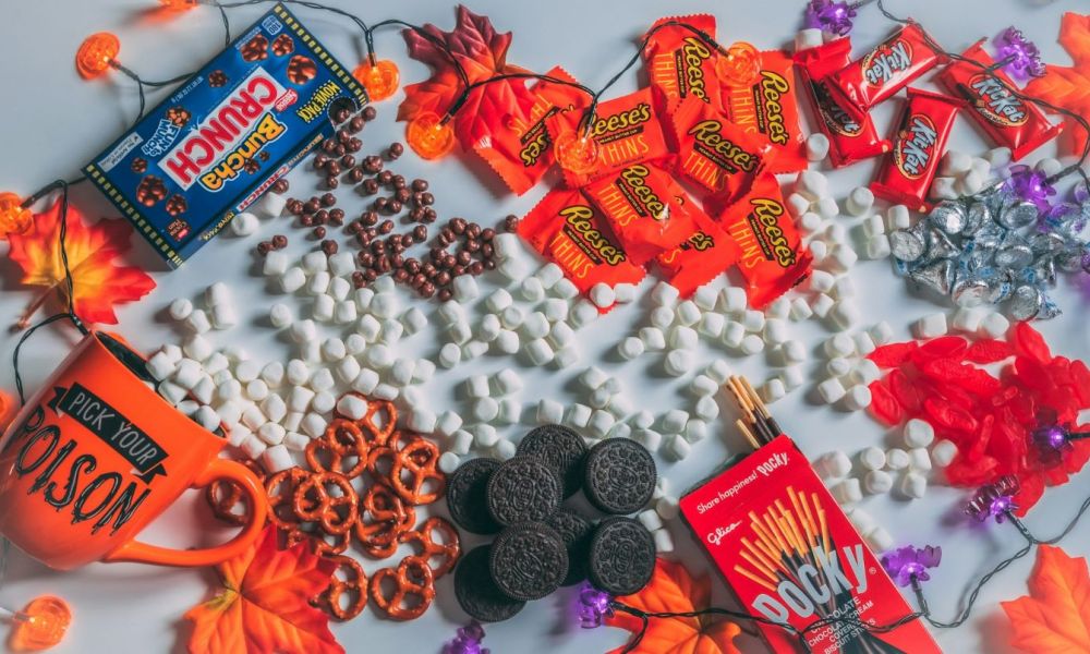 Different Halloween candy scattered on the table