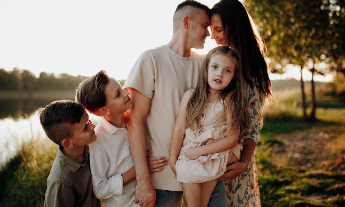 Family of five posing for a photo shoot