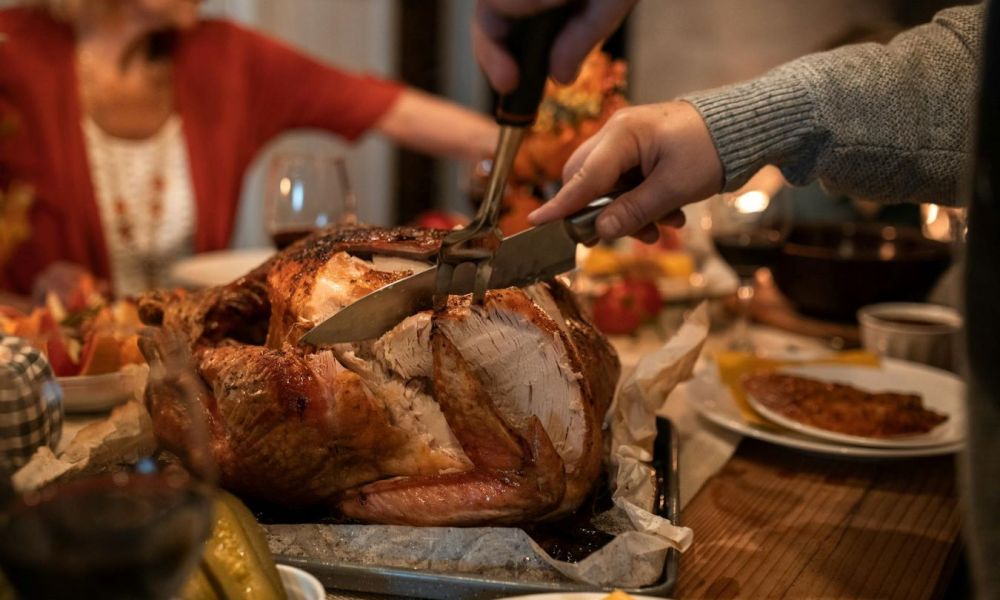 Carving the turkey at Thanksgiving dinner