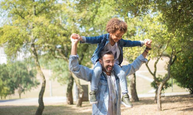 Father daughter outside smiling